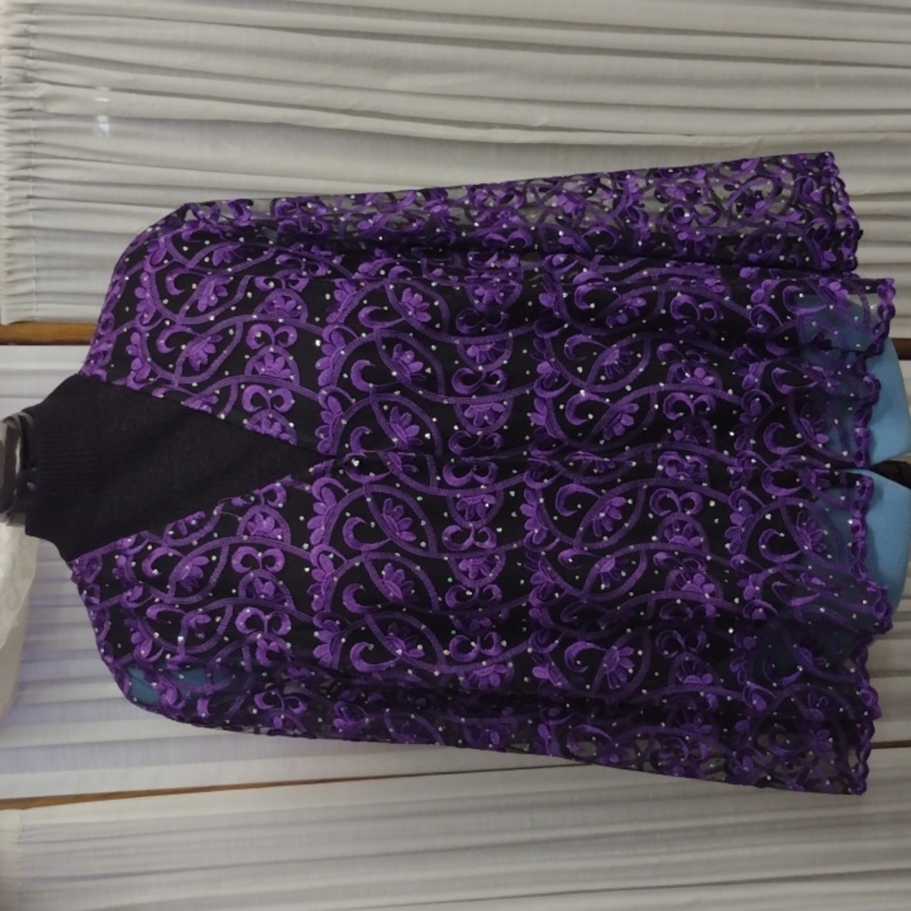 Channa 1X purple lace jacket on sheer black background with rhinestones.